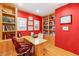 Home office with custom built-in shelves, wood floors, and bright windows at 9 Contra Costa Pl, Henderson, NV 89052