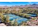 A high angle view of community tennis courts nestled in a serene landscape at 9 Contra Costa Pl, Henderson, NV 89052