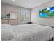 Bedroom featuring a comfy bed, soft lighting, and a large dresser at 9416 Rolling Ridge Ln, Las Vegas, NV 89134