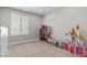 ' bedroom featuring a window with shutters and play furniture at 9416 Rolling Ridge Ln, Las Vegas, NV 89134