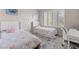 Charming ' bedroom with two twin beds, plush pillows, and lots of natural light at 9416 Rolling Ridge Ln, Las Vegas, NV 89134