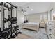 Spacious main bedroom featuring a home gym and a ceiling fan at 9416 Rolling Ridge Ln, Las Vegas, NV 89134