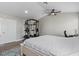 Bright main bedroom featuring light gray walls and wood-look flooring at 9416 Rolling Ridge Ln, Las Vegas, NV 89134