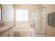 Bright bathroom features a soaking tub, glass enclosed shower, and granite vanity top at 9750 W Cherokee Ave, Las Vegas, NV 89147