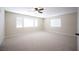 Spacious bedroom with carpet, ceiling fan, and multiple windows at 9750 W Cherokee Ave, Las Vegas, NV 89147