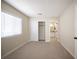 Bedroom with carpet, natural light, and walk-in closet, and bathroom access at 9750 W Cherokee Ave, Las Vegas, NV 89147