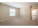 Cozy bedroom with plush carpeting and a window providing plenty of natural light at 9750 W Cherokee Ave, Las Vegas, NV 89147