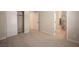 Carpeted bedroom boasts walk-in closet and ensuite bathroom at 9750 W Cherokee Ave, Las Vegas, NV 89147