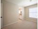 Neutral bedroom with carpet, natural light, and view into a bathroom at 9750 W Cherokee Ave, Las Vegas, NV 89147