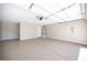 Spacious garage with epoxy flooring, providing ample parking and storage space with a neutral color palette at 9750 W Cherokee Ave, Las Vegas, NV 89147