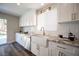 Bright kitchen featuring white cabinets, granite countertops, and stainless steel appliances at 9750 W Cherokee Ave, Las Vegas, NV 89147