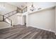 Bright living room with soaring ceilings, modern staircase, wood floors, and lots of natural light at 9750 W Cherokee Ave, Las Vegas, NV 89147