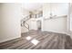 Bright living room with soaring ceilings, modern staircase, wood floors, and lots of natural light at 9750 W Cherokee Ave, Las Vegas, NV 89147