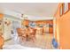 Open concept kitchen and dining area with tile flooring and abundant counter space, perfect for Gathering gatherings at 9879 Jazzy June St, Las Vegas, NV 89183