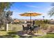 Backyard with a covered seating area offering views of the surrounding landscape at 134 Wentworth Dr, Henderson, NV 89074