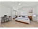 Bedroom with large mirror doors, bed and desk at 134 Wentworth Dr, Henderson, NV 89074