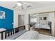 Bedroom with a blue accent wall and mirrored closet doors at 134 Wentworth Dr, Henderson, NV 89074