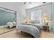 Bedroom with a sliding mirrored closet door, ceiling fan, and view of the window at 134 Wentworth Dr, Henderson, NV 89074