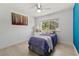 Bright bedroom with a large window, ceiling fan, and cozy decor at 134 Wentworth Dr, Henderson, NV 89074