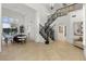 Inviting foyer featuring a grand staircase, elegant tile flooring, and plenty of natural light at 134 Wentworth Dr, Henderson, NV 89074