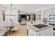 Open kitchen and living area with granite countertops and stainless steel appliances at 134 Wentworth Dr, Henderson, NV 89074