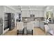 Modern kitchen with stainless steel appliances, granite countertops, and a breakfast bar at 134 Wentworth Dr, Henderson, NV 89074