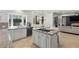 Bright, airy kitchen featuring white cabinets, granite counters, and a bay window with sink at 134 Wentworth Dr, Henderson, NV 89074