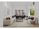 Bright living room with high ceilings, modern decor, and plenty of natural light at 134 Wentworth Dr, Henderson, NV 89074