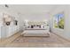 Serene bedroom with natural light and hardwood floors, designed for comfort and relaxation at 134 Wentworth Dr, Henderson, NV 89074