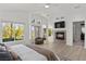This bedroom has lots of natural light and a fireplace at 134 Wentworth Dr, Henderson, NV 89074