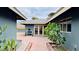 Enclosed backyard featuring a brick patio, xeriscaping, and access to additional buildings at 1801 Griffith Ave, Las Vegas, NV 89104