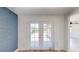 The property has glass doors with a view of the sunny backyard and patio at 1801 Griffith Ave, Las Vegas, NV 89104