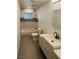 Renovated bathroom with bathtub, unique tile flooring and updated vanity at 1801 Griffith Ave, Las Vegas, NV 89104