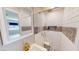 A stylish bathroom showcases a modern shower with white subway tile, gold fixtures, and patterned accent tiles at 1801 Griffith Ave, Las Vegas, NV 89104