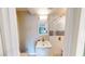 Charming bathroom with a vanity and shower featuring subway tile with decorative accent tiles at 1801 Griffith Ave, Las Vegas, NV 89104