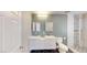 This is a bathroom with double sinks, a toilet, and a shower with black and white patterned tile at 1801 Griffith Ave, Las Vegas, NV 89104