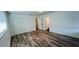 Bedroom with vinyl floors, window with blinds, and large closet with sliding doors at 1801 Griffith Ave, Las Vegas, NV 89104