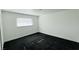 Carpeted bedroom with natural light from a window and closet with paneled doors at 1801 Griffith Ave, Las Vegas, NV 89104