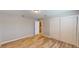 Neutral bedroom featuring wood-look floors, and closet with sliding doors at 1801 Griffith Ave, Las Vegas, NV 89104