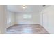 Bright bedroom features wood-look floors, a window for natural light, and a closet with paneled doors at 1801 Griffith Ave, Las Vegas, NV 89104