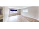 Light-filled bedroom showcasing wood-look floors, and large windows at 1801 Griffith Ave, Las Vegas, NV 89104