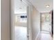 Inviting entryway featuring wood-look flooring, a secure front door, and a glimpse into a bright, airy living space at 1801 Griffith Ave, Las Vegas, NV 89104