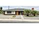 Charming single-story home featuring a unique window design and mature palm trees at 1801 Griffith Ave, Las Vegas, NV 89104