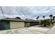 A wide driveway connects the garage and the main house, with desert landscaping at 1801 Griffith Ave, Las Vegas, NV 89104