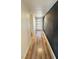 Long hallway leading to the front door with light vinyl floors at 1801 Griffith Ave, Las Vegas, NV 89104