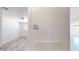 Bright home with light walls, flooring, and temperature control unit in the hallway at 1801 Griffith Ave, Las Vegas, NV 89104