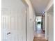 Hallway leads into a dining area with decor wallpaper, barn door, and various doorways at 1801 Griffith Ave, Las Vegas, NV 89104