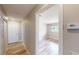 Hallway with a view to bedroom, showcasing the home's updated interior and wood-look floors at 1801 Griffith Ave, Las Vegas, NV 89104