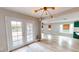 Open living space featuring french doors, wood floors, and a view to other rooms in the home at 1801 Griffith Ave, Las Vegas, NV 89104