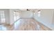 Bright living room with wood floors, white walls, and ceiling fan, offering a spacious and airy feel at 1801 Griffith Ave, Las Vegas, NV 89104